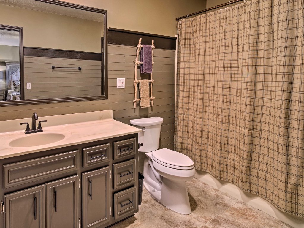 Rebel Retreat Cabin with Stadium Seating Home Theater Vacation Rental in Sevierville - RedAwning